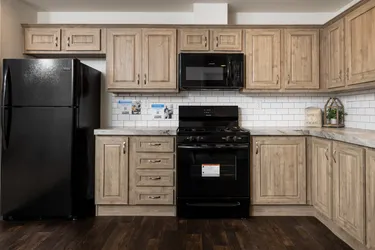 The FAIRPOINT 24403A Kitchen. This Manufactured Mobile Home features 3 bedrooms and 2 baths.