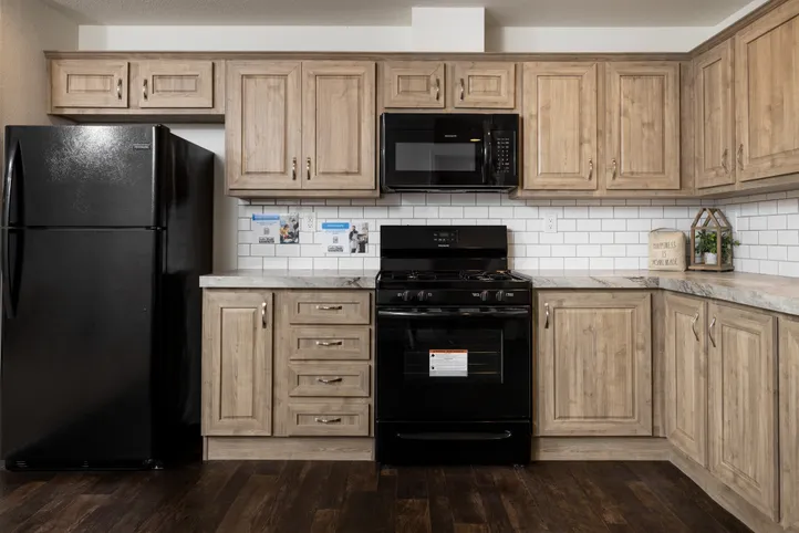 The FAIRPOINT 24403A Kitchen. This Manufactured Mobile Home features 3 bedrooms and 2 baths.