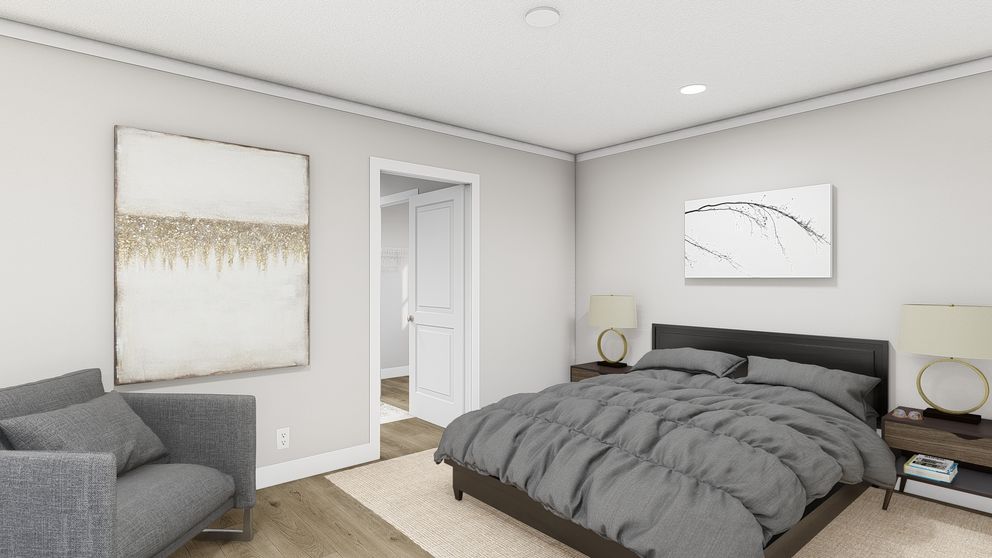 The SWEET CAROLINE Primary Bedroom. This Manufactured Mobile Home features 3 bedrooms and 2 baths.