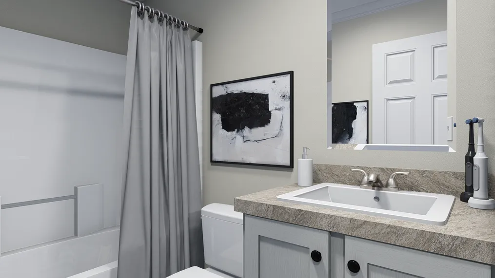 The 4202 "HATTERAS" 6616 Guest Bathroom. This Manufactured Mobile Home features 3 bedrooms and 2 baths.