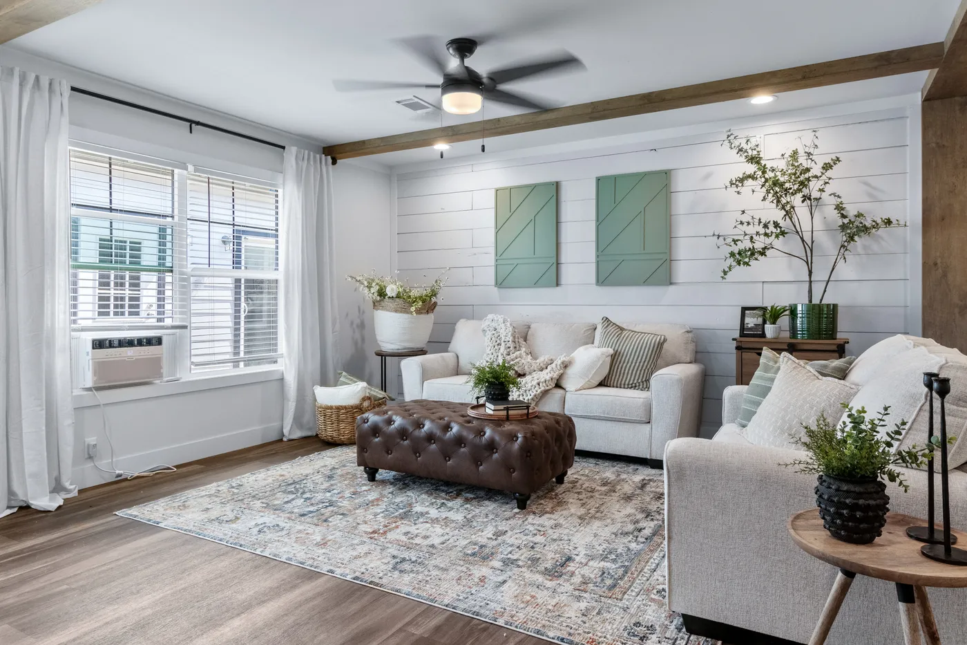 The SAWYER ELITE Living Room. This Manufactured Mobile Home features 3 bedrooms and 2 baths.