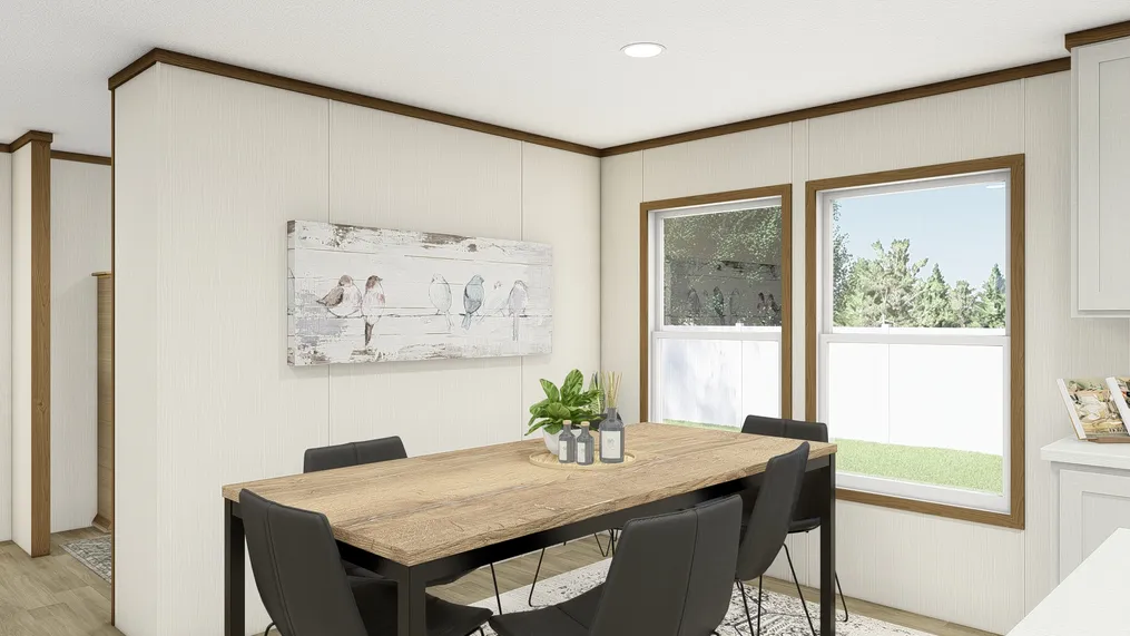 The THE IMPACT Dining Area. This Manufactured Mobile Home features 4 bedrooms and 2 baths.