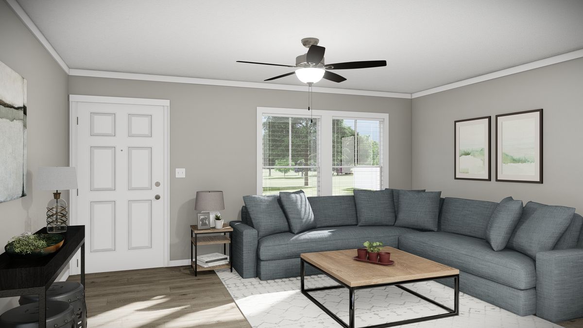 The THE REVERE Living Room. This Manufactured Mobile Home features 4 bedrooms and 2 baths.