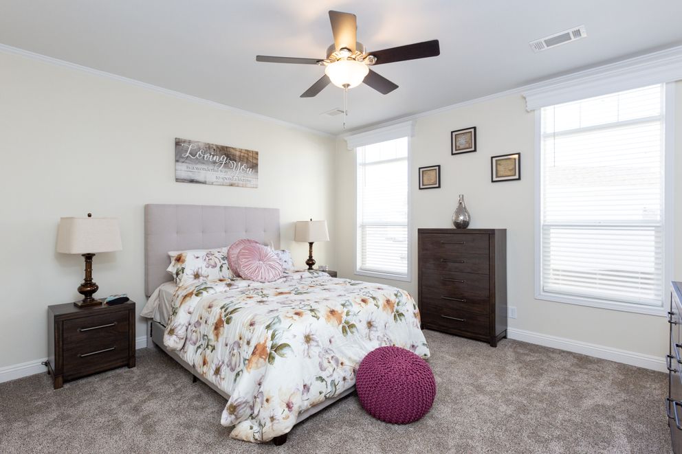The SUM3076A Primary Bedroom. This Manufactured Mobile Home features 4 bedrooms and 2.5 baths.