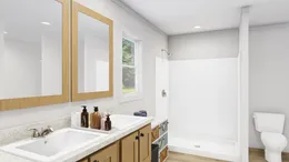 The LET IT BE Primary Bathroom. This Manufactured Mobile Home features 3 bedrooms and 2 baths.