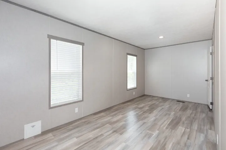 The BLAZER 66 F Primary Bedroom. This Manufactured Mobile Home features 3 bedrooms and 2 baths.