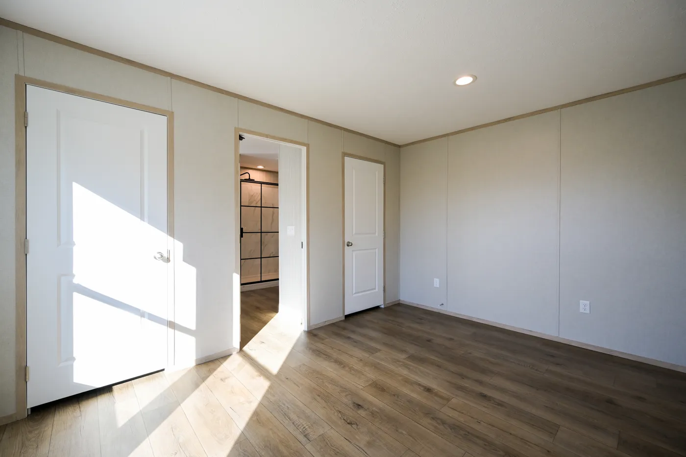 The TIGER'S EYE 7416-456 Primary Bedroom. This Manufactured Mobile Home features 3 bedrooms and 2 baths.