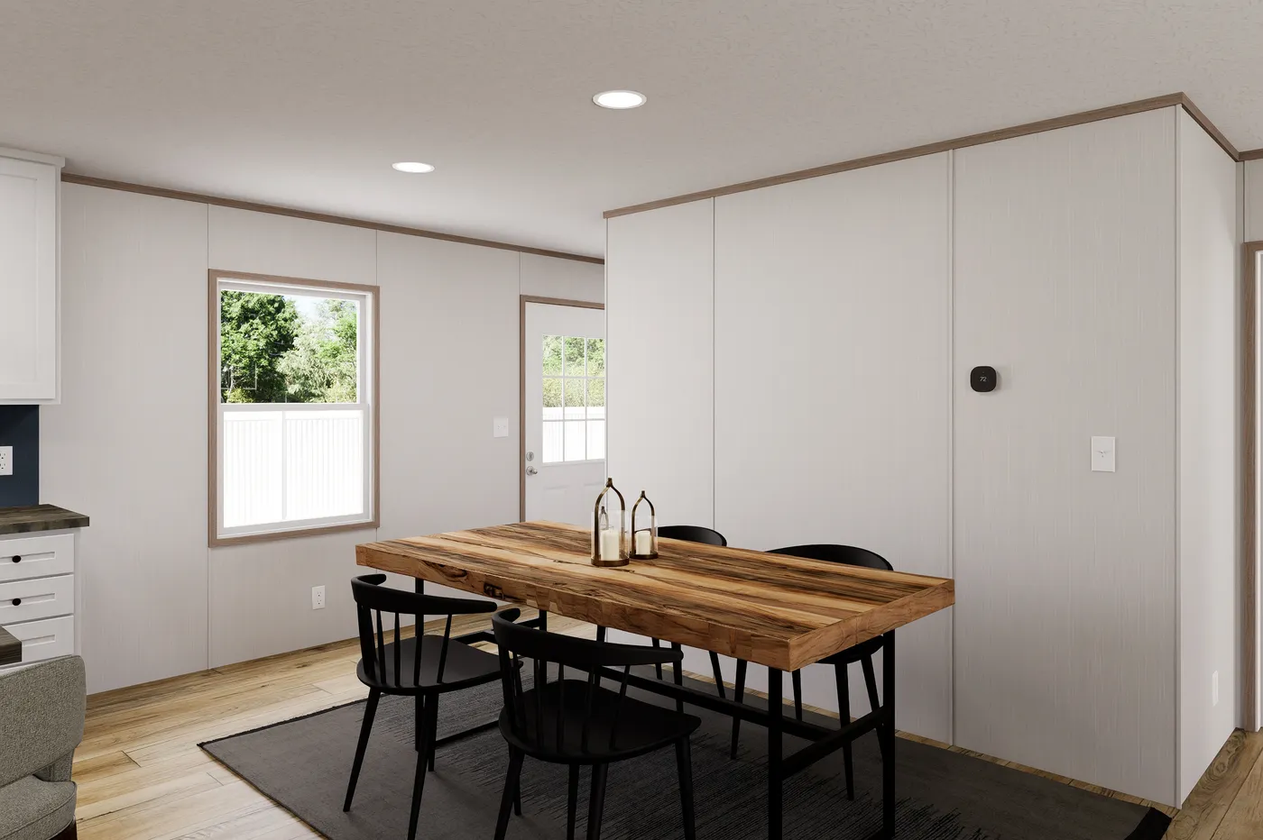 The ULTRA FLEX 48 Dining Area. This Manufactured Mobile Home features 3 bedrooms and 2 baths.