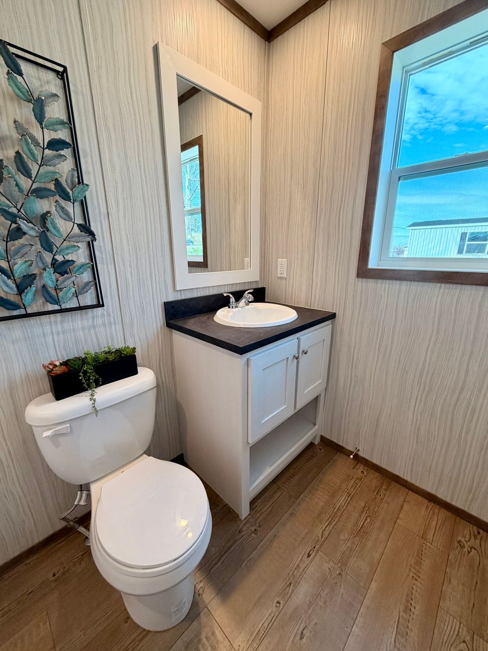 The APATITE Guest Bathroom. This Manufactured Mobile Home features 3 bedrooms and 2 baths.