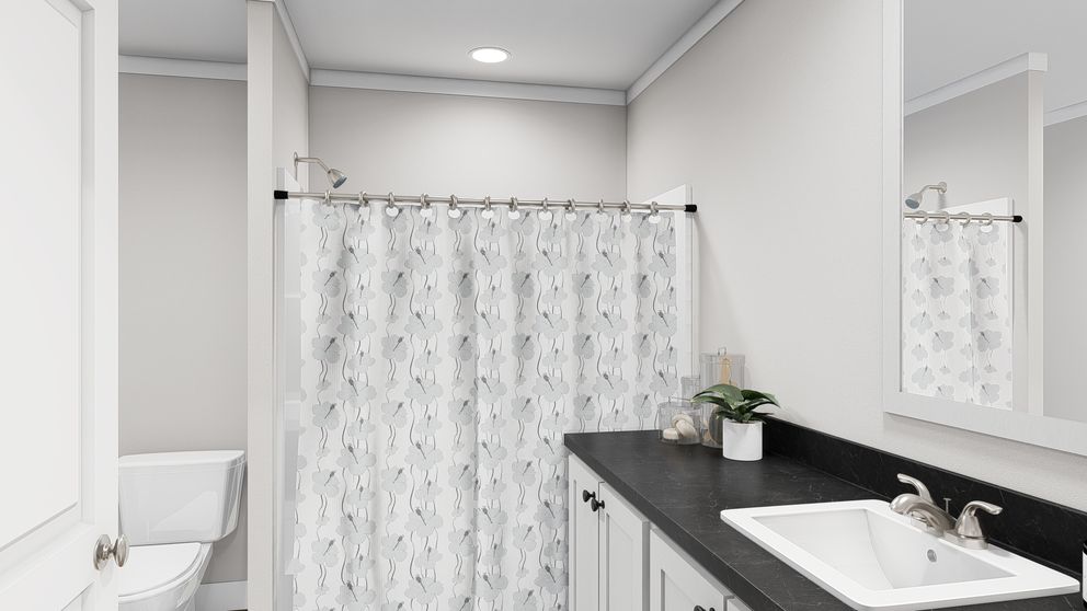 The LET IT BE Guest Bathroom. This Manufactured Mobile Home features 3 bedrooms and 2 baths.