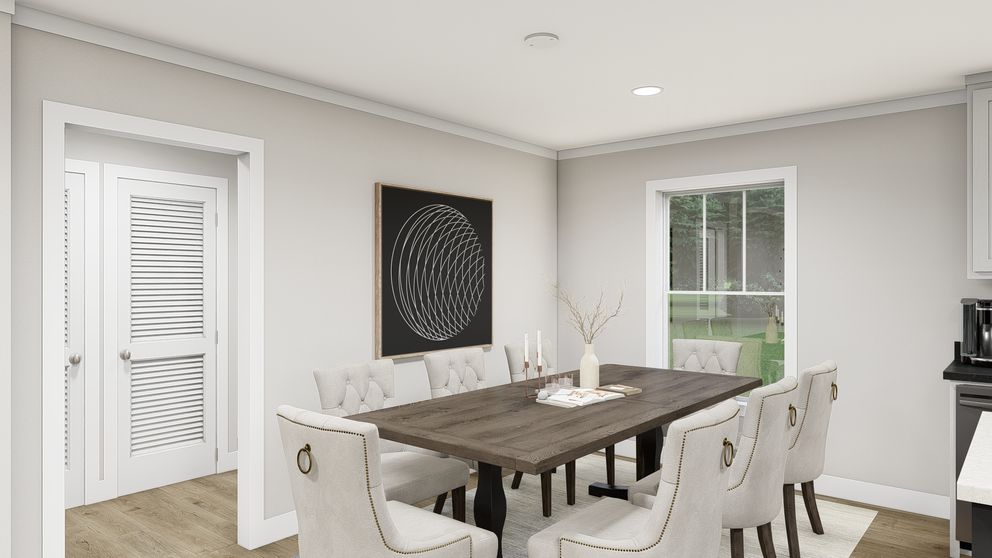 The LEAN ON ME Dining Room. This Manufactured Mobile Home features 3 bedrooms and 2 baths.