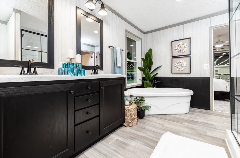 The 6428-E792 THE PULSE Primary Bathroom. This Manufactured Mobile Home features 3 bedrooms and 2.5 baths.