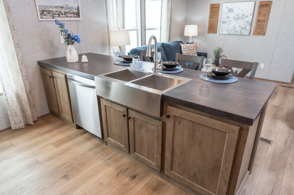 The WARRIOR II Kitchen. This Manufactured Mobile Home features 2 bedrooms and 2 baths.