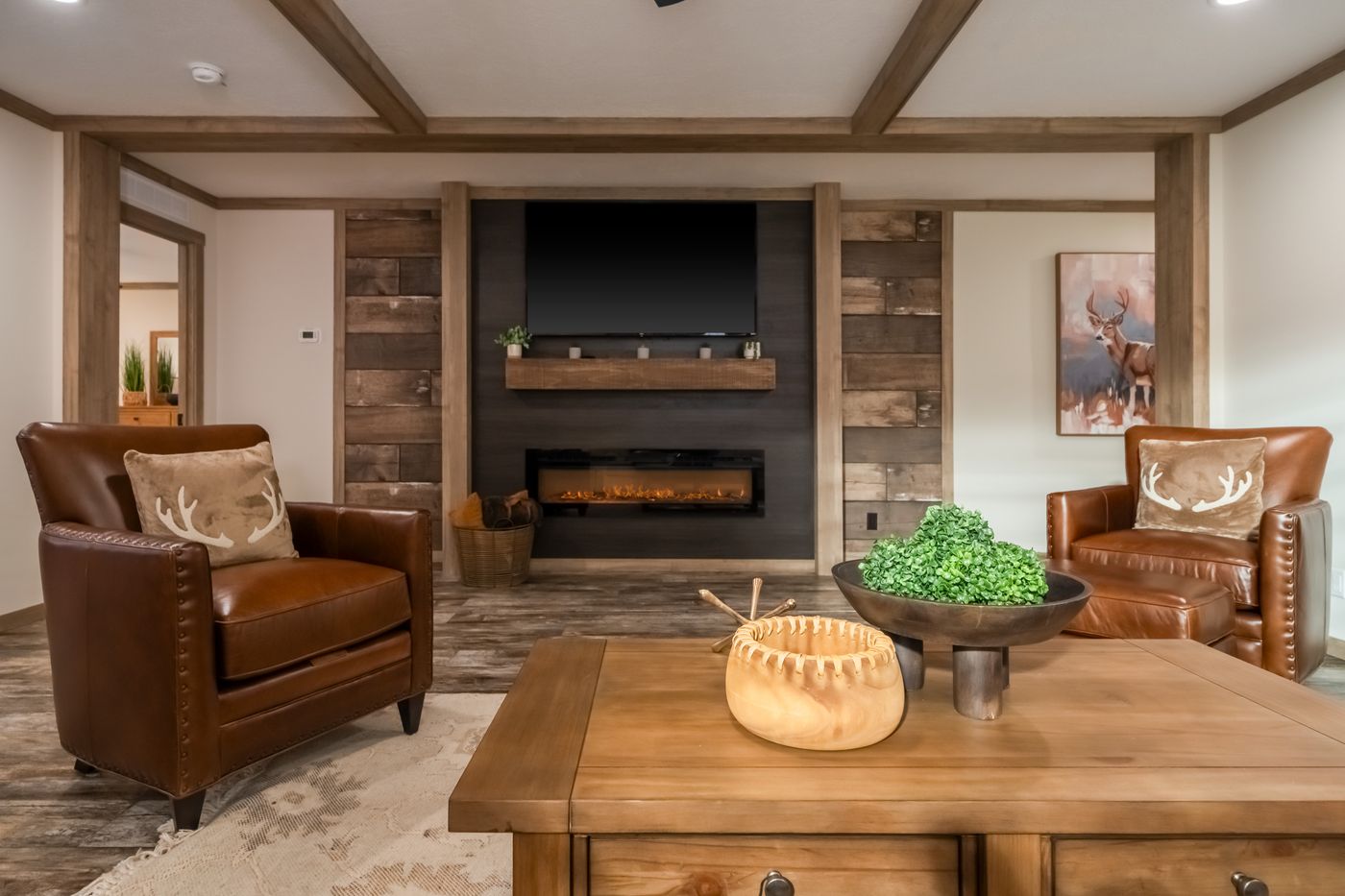 The BOUJEE PREMIER Living Room. This Manufactured Mobile Home features 4 bedrooms and 2 baths.