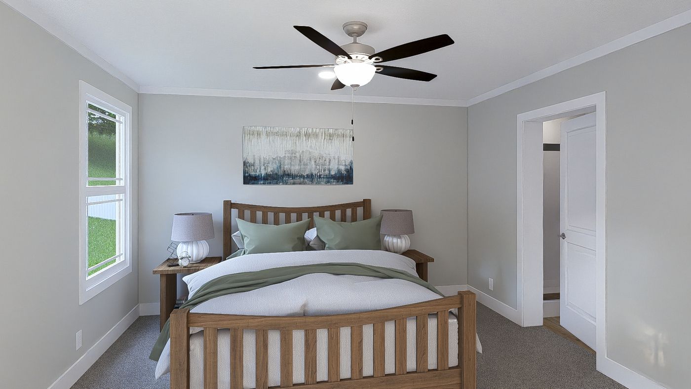 The THE BREEZE 64 Primary Bedroom. This Manufactured Mobile Home features 4 bedrooms and 2 baths.