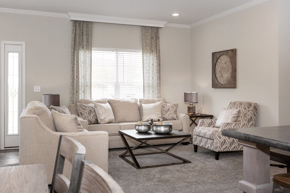 The KENNESAW ELITE Living Room. This Manufactured Mobile Home features 4 bedrooms and 2 baths.