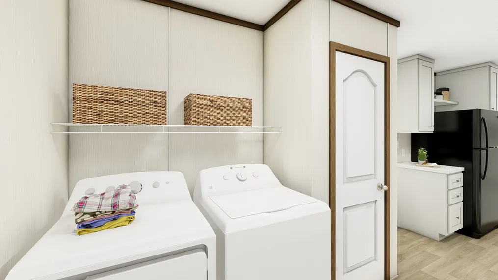 The ESSENCE Utility Room. This Manufactured Mobile Home features 3 bedrooms and 2 baths.
