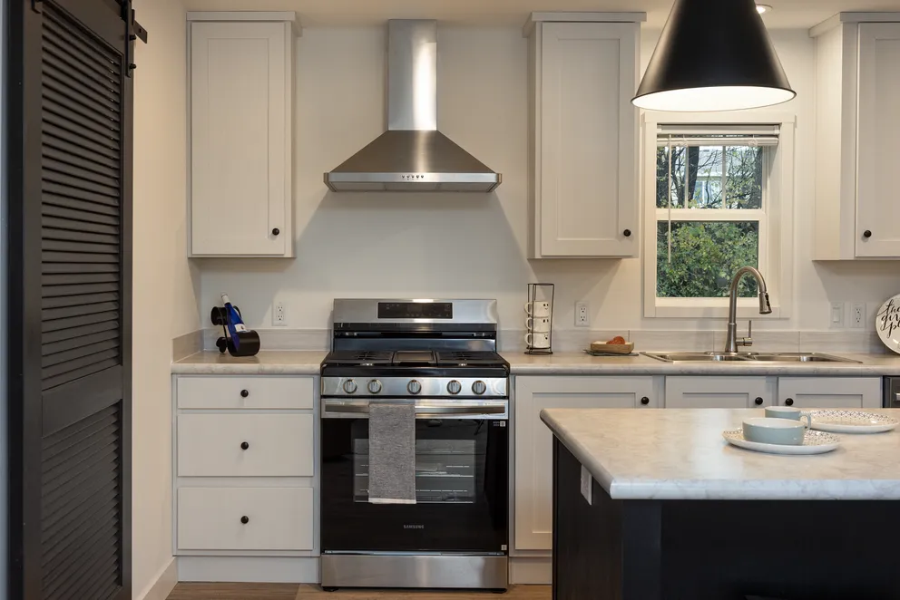 The HEY JUDE Kitchen. This Manufactured Mobile Home features 4 bedrooms and 2 baths.