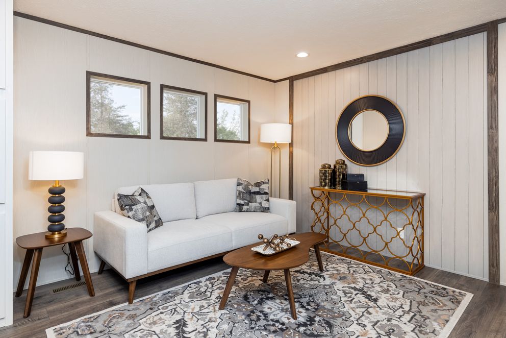 The INTUITION Living Room. This Manufactured Mobile Home features 3 bedrooms and 2 baths.