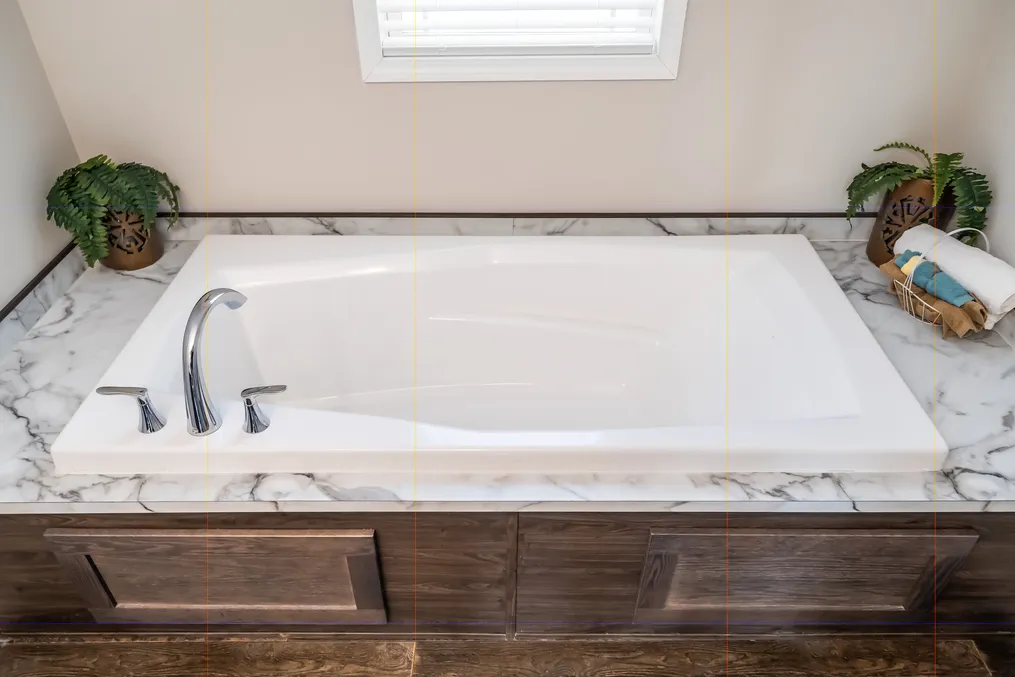 The MAVERICK 56A Primary Bathroom. This Manufactured Mobile Home features 3 bedrooms and 2 baths.