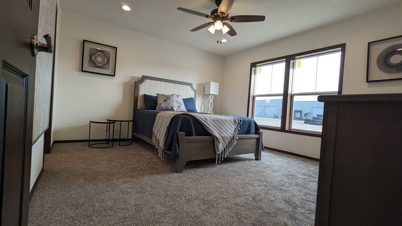 The LEGEND 327-1 Primary Bedroom. This Manufactured Mobile Home features 3 bedrooms and 2 baths.