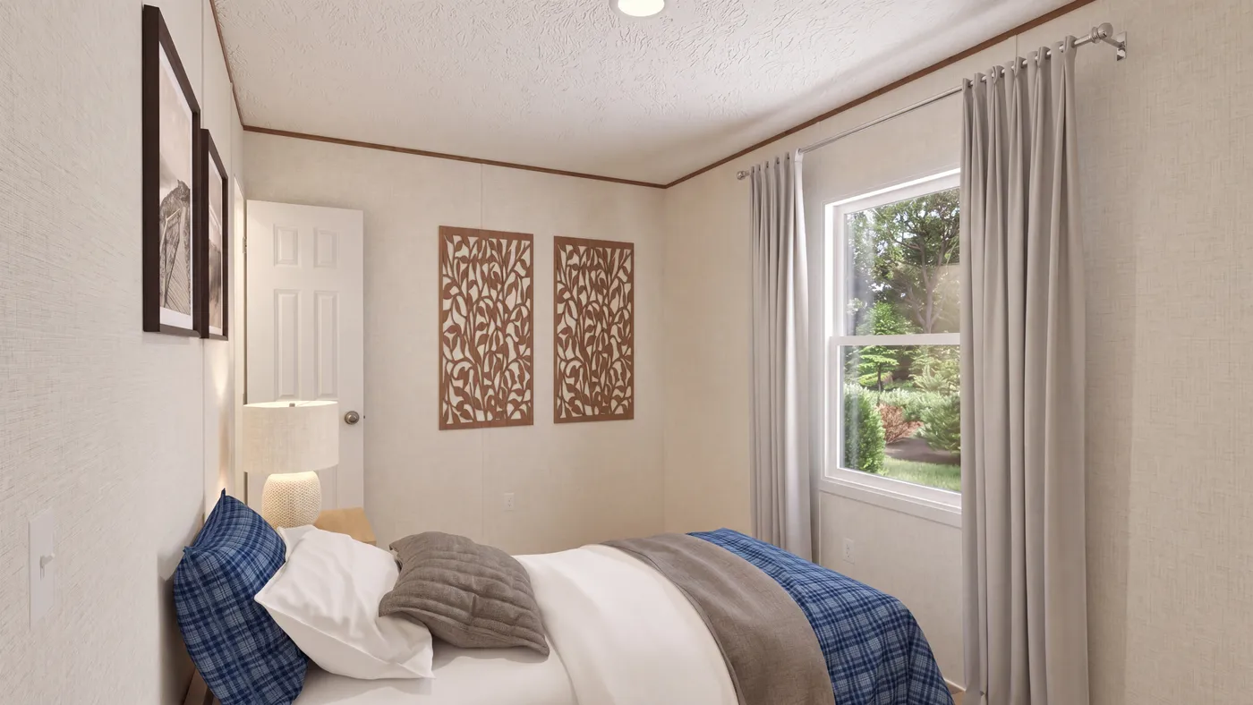 The DOGWOOD Guest Bedroom. This Manufactured Mobile Home features 2 bedrooms and 2 baths.