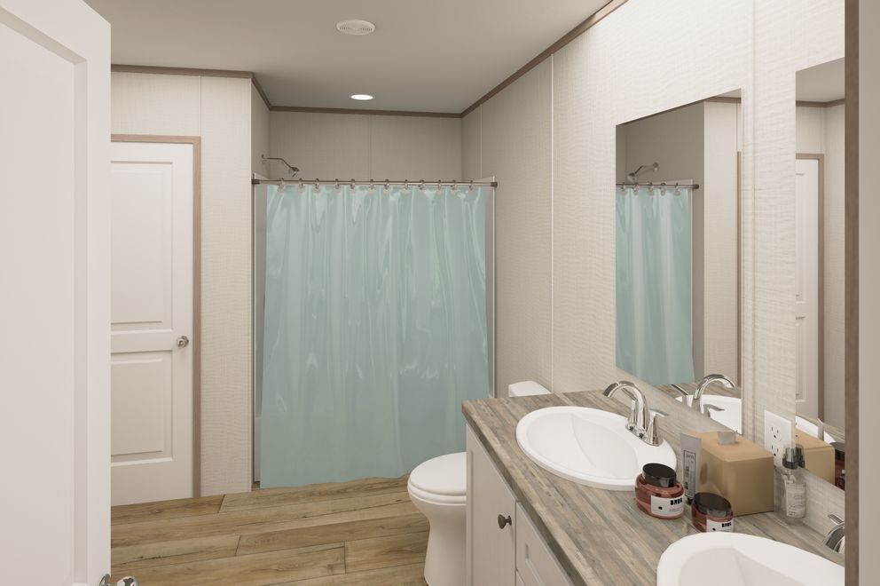 The ULTRA FLEX Primary Bathroom. This Manufactured Mobile Home features 4 bedrooms and 2 baths.