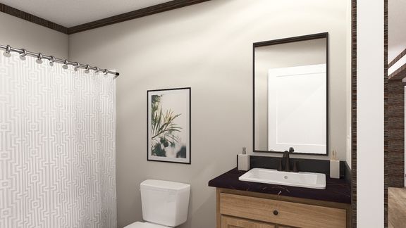 The THE JACKSON Guest Bathroom. This Manufactured Mobile Home features 4 bedrooms and 2 baths.