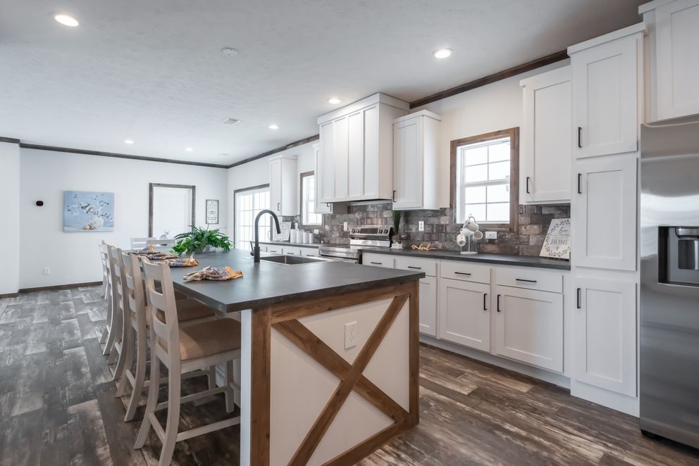 The 3237 THE TYBEE HUD Kitchen. This Manufactured Mobile Home features 4 bedrooms and 3 baths.