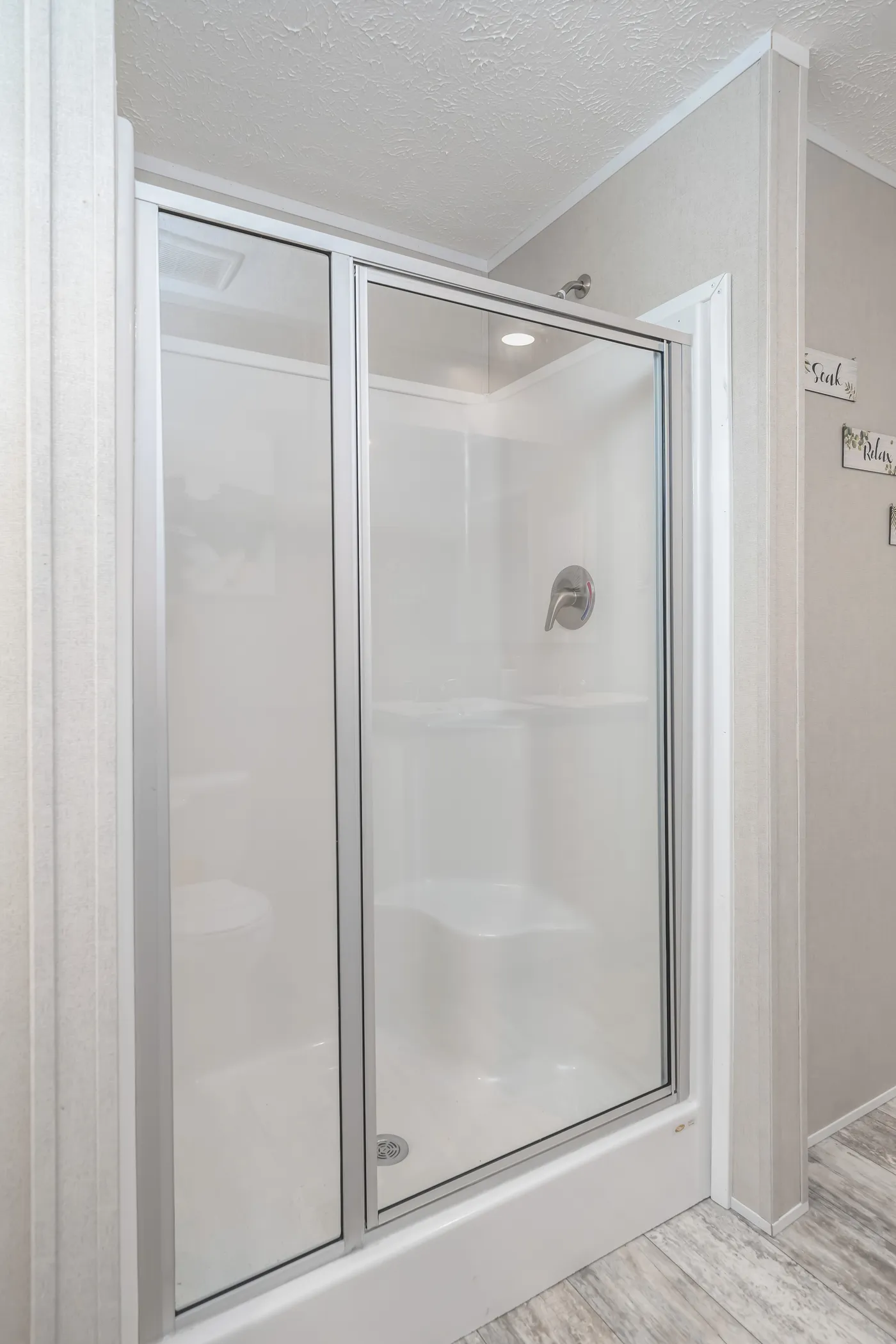 The BENJAMIN Primary Bathroom. This Manufactured Mobile Home features 3 bedrooms and 2 baths.