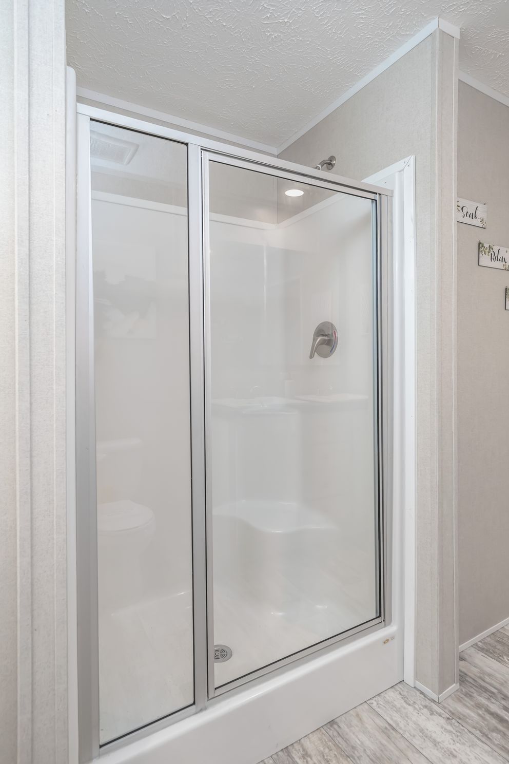 The BENJAMIN Primary Bathroom. This Manufactured Mobile Home features 3 bedrooms and 2 baths.