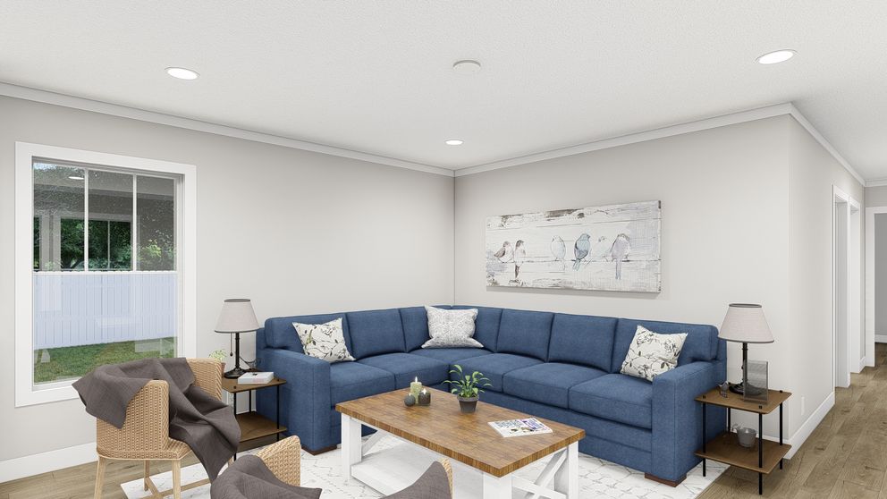 The MOVE ON UP Living Room. This Manufactured Mobile Home features 3 bedrooms and 2 baths.