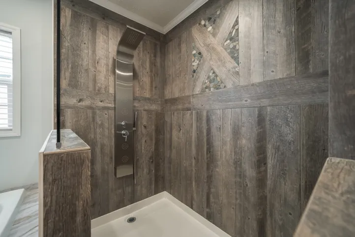 The THE HEWITT Primary Bathroom. This Manufactured Mobile Home features 4 bedrooms and 3 baths.