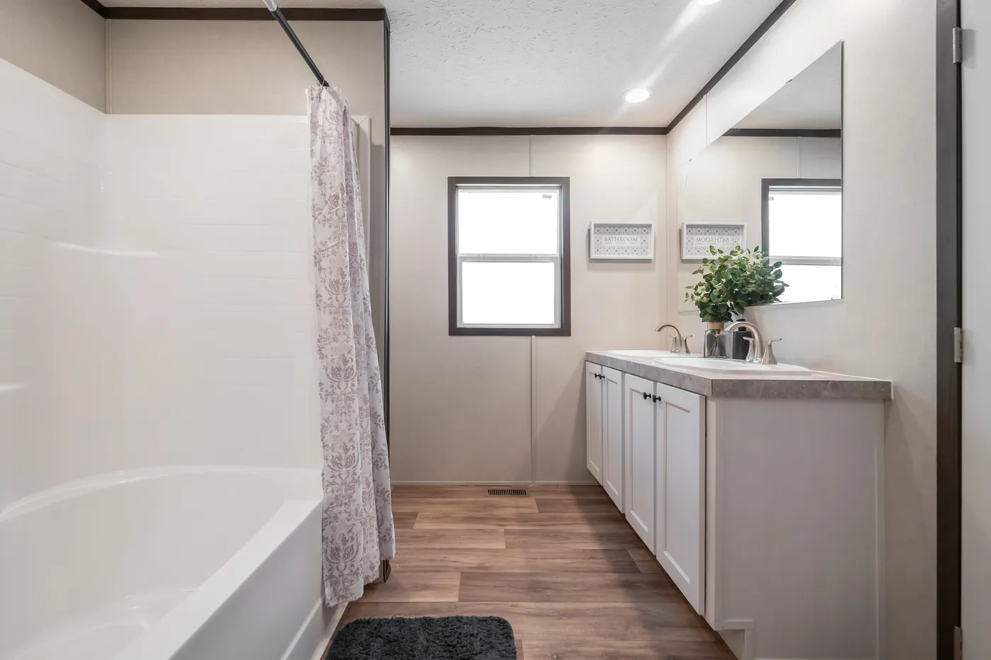 The ESSENCE Guest Bathroom. This Manufactured Mobile Home features 3 bedrooms and 2 baths.