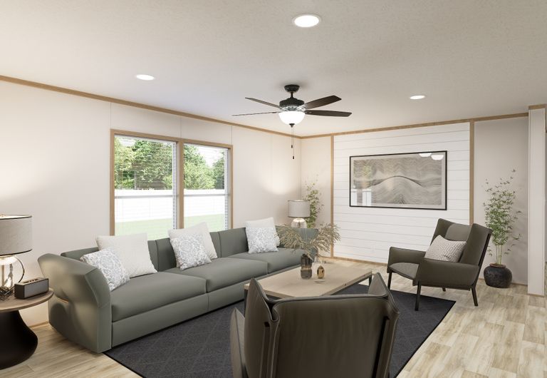 The THE MOUNTAINEER 72 Living Room. This Manufactured Mobile Home features 3 bedrooms and 2 baths.