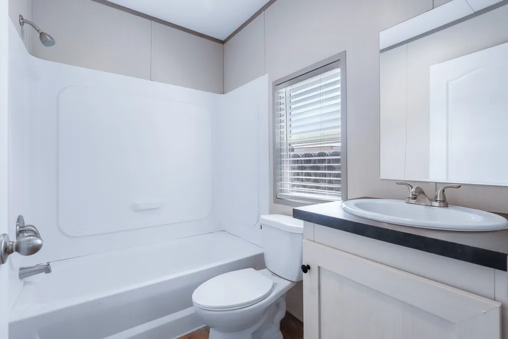 The ANNIVERSARY 16602A Guest Bathroom. This Manufactured Mobile Home features 2 bedrooms and 2 baths.