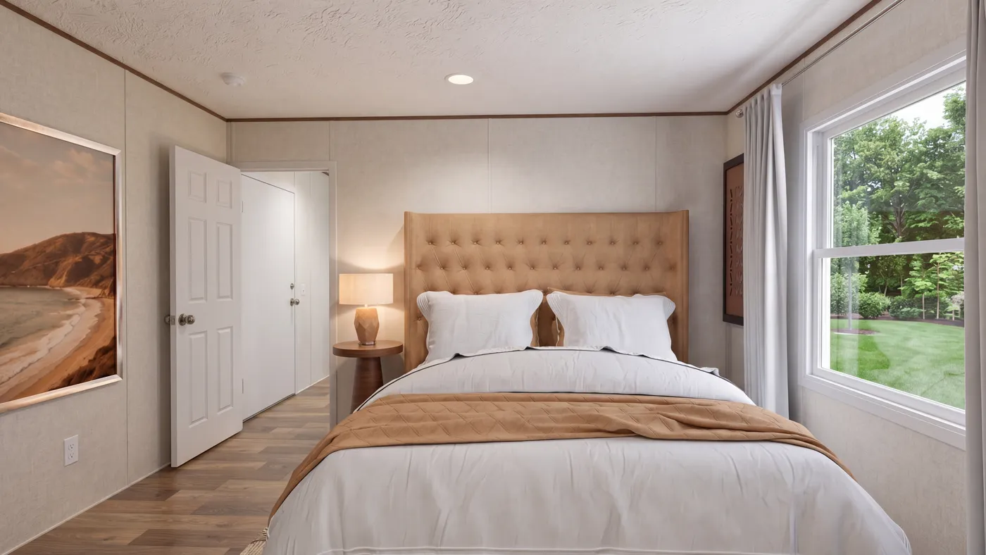 The HICKORY Primary Bedroom. This Manufactured Mobile Home features 3 bedrooms and 2 baths.