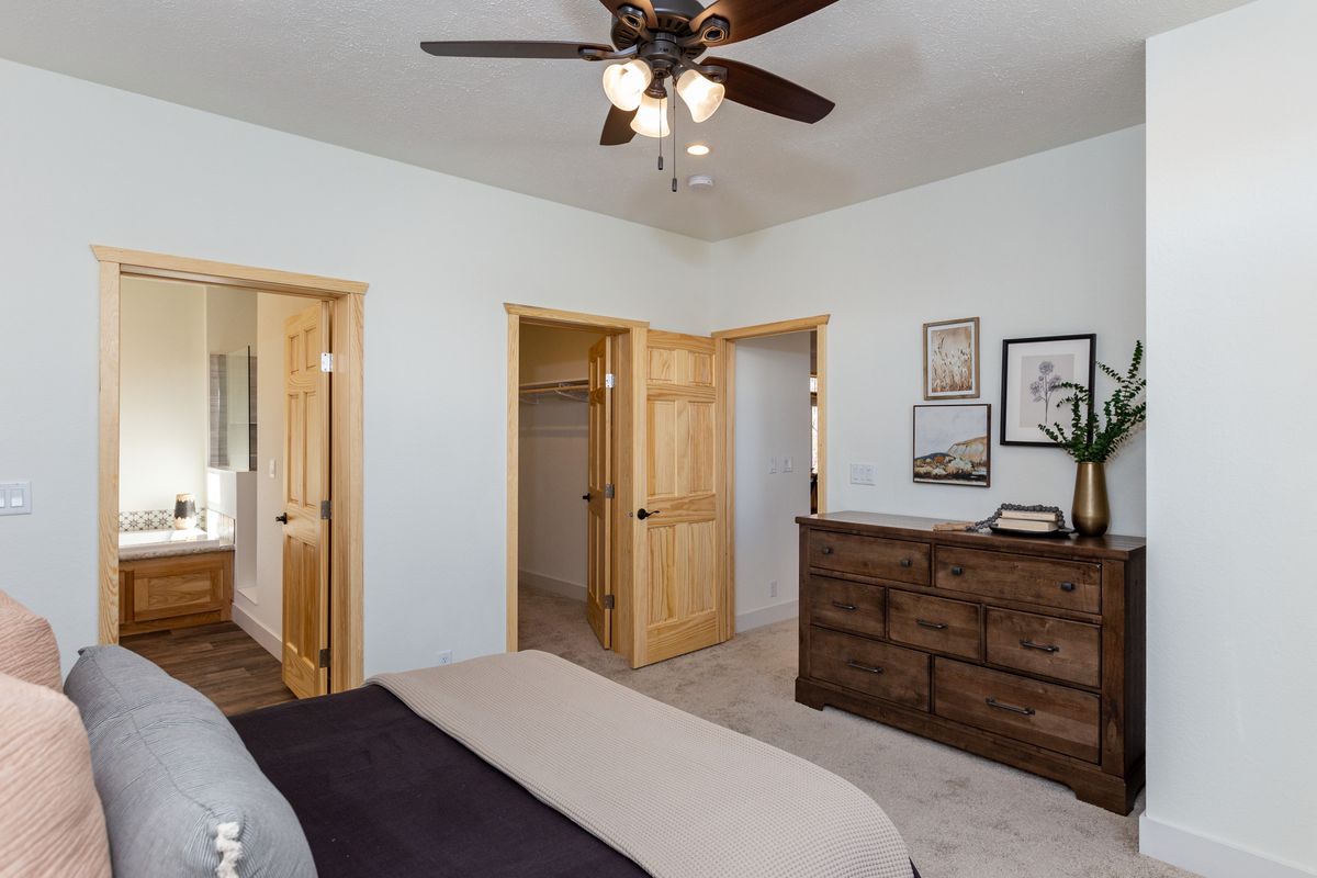 The LEGACY 412 Primary Bedroom. This Manufactured Mobile Home features 3 bedrooms and 2 baths.