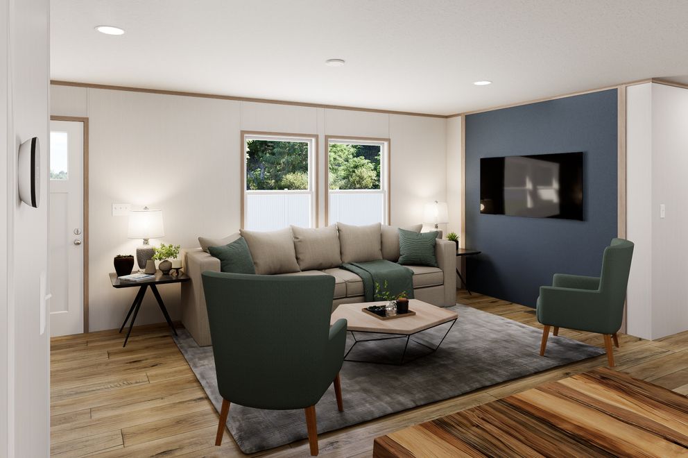 The ULTRA FLEX Living Room. This Manufactured Mobile Home features 3 bedrooms and 2 baths.