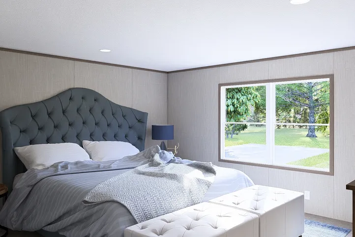 The LEGEND BIG BOY Primary Bedroom. This Manufactured Mobile Home features 4 bedrooms and 2 baths.