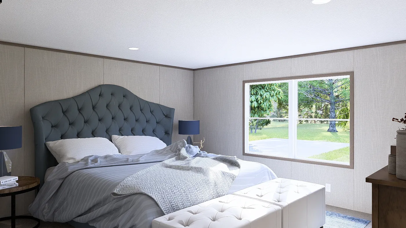 The LEGEND BIG BOY Primary Bedroom. This Manufactured Mobile Home features 4 bedrooms and 2 baths.