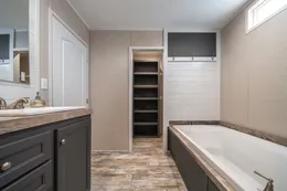 The ANNIVERSARY CHOICE Primary Bathroom. This Manufactured Mobile Home features 3 bedrooms and 2 baths.
