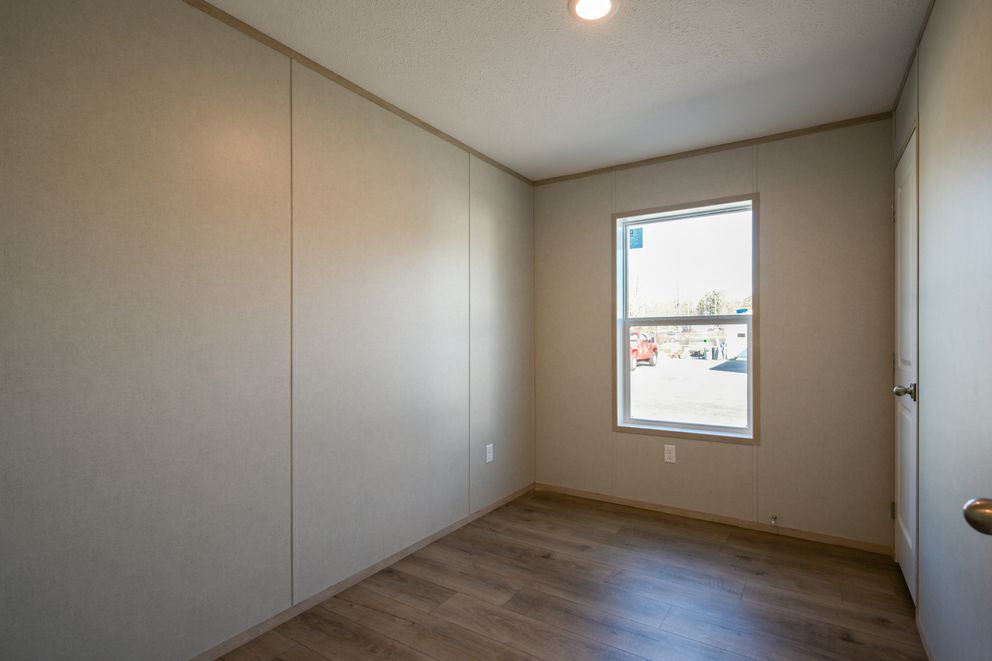 The TIGER'S EYE 7416-456 Guest Bedroom. This Manufactured Mobile Home features 3 bedrooms and 2 baths.