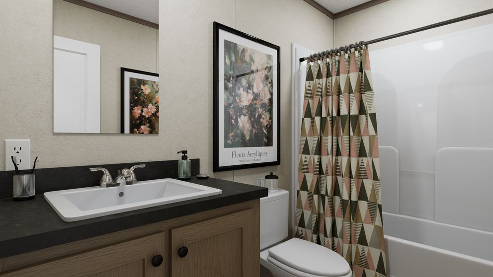 The 6614-CC02 CLEARPATH 66 Guest Bathroom. This Manufactured Mobile Home features 3 bedrooms and 2 baths.