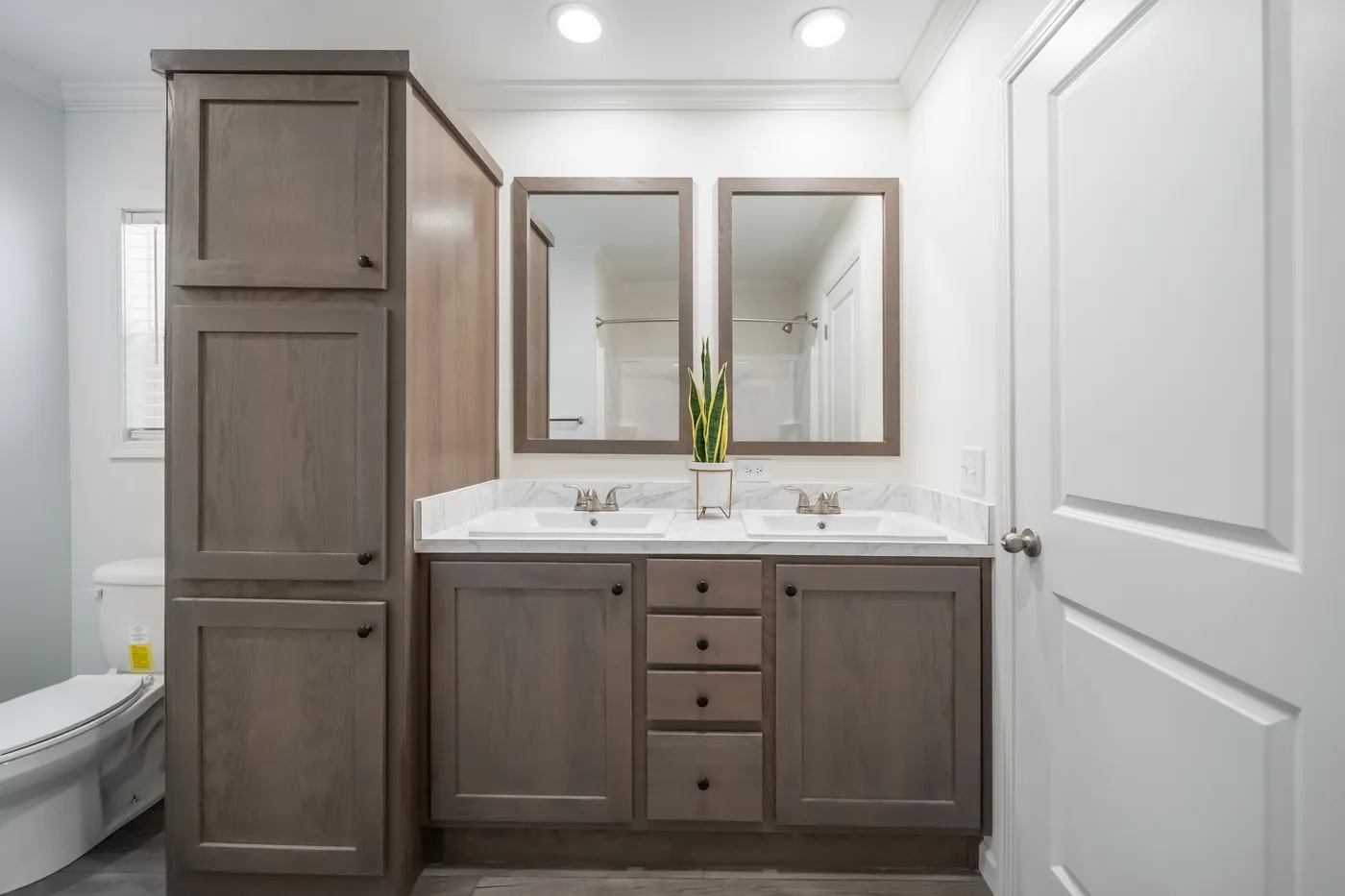 The 4200 "SOUTHPORT" 58'4X16 Primary Bathroom. This Manufactured Mobile Home features 2 bedrooms and 2 baths.