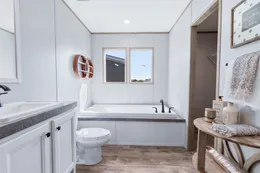 The THE RENEGADE Primary Bathroom. This Manufactured Mobile Home features 3 bedrooms and 2 baths.