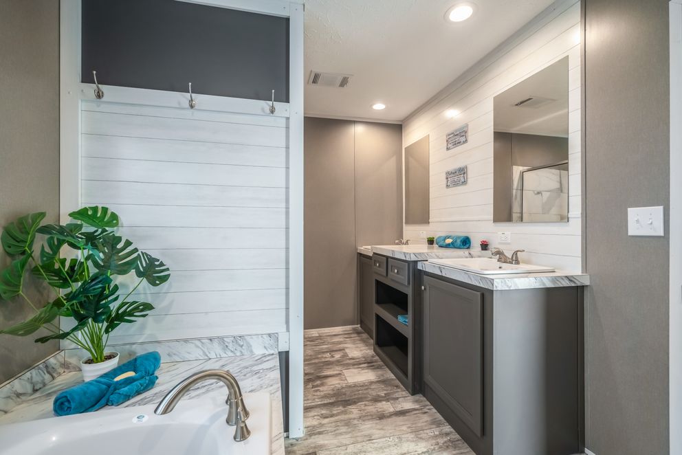 The MAJOR Primary Bathroom. This Manufactured Mobile Home features 3 bedrooms and 2 baths.