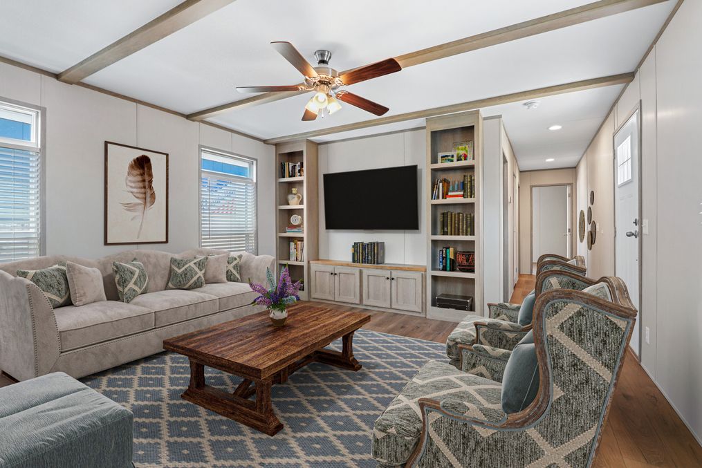 The ANNIVERSARY 16763F Living Room. This Manufactured Mobile Home features 3 bedrooms and 2 baths.