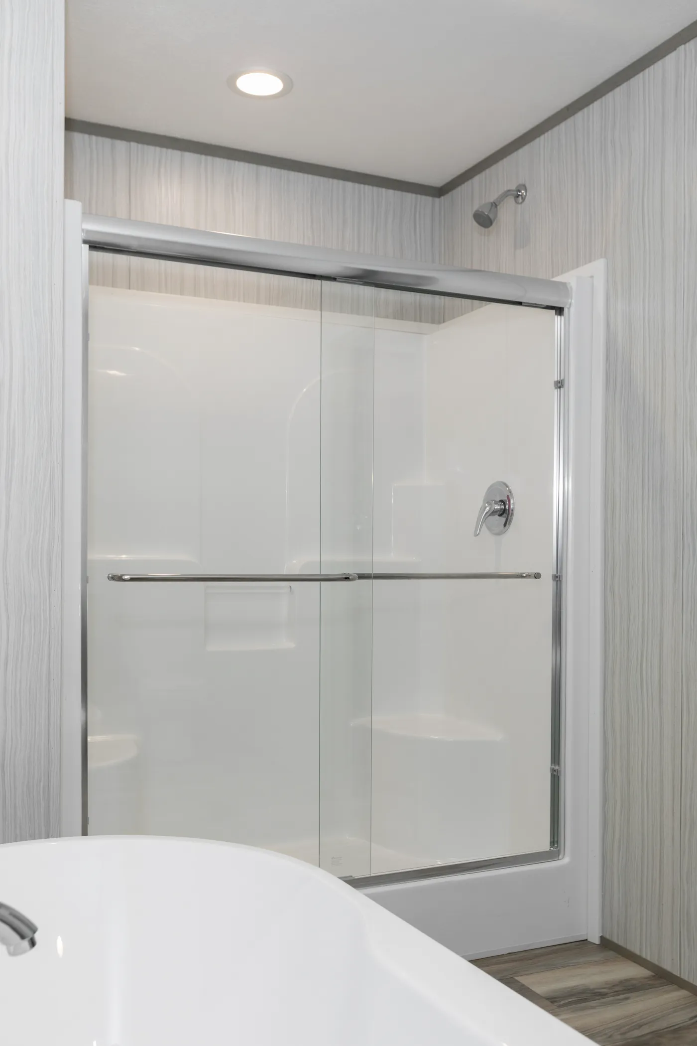 The THE OLYMPUS Primary Bathroom. This Manufactured Mobile Home features 3 bedrooms and 2 baths.