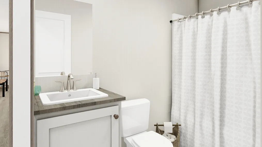 The ULTRA A-PLUS 16X76 Guest Bathroom. This Manufactured Mobile Home features 3 bedrooms and 2 baths.